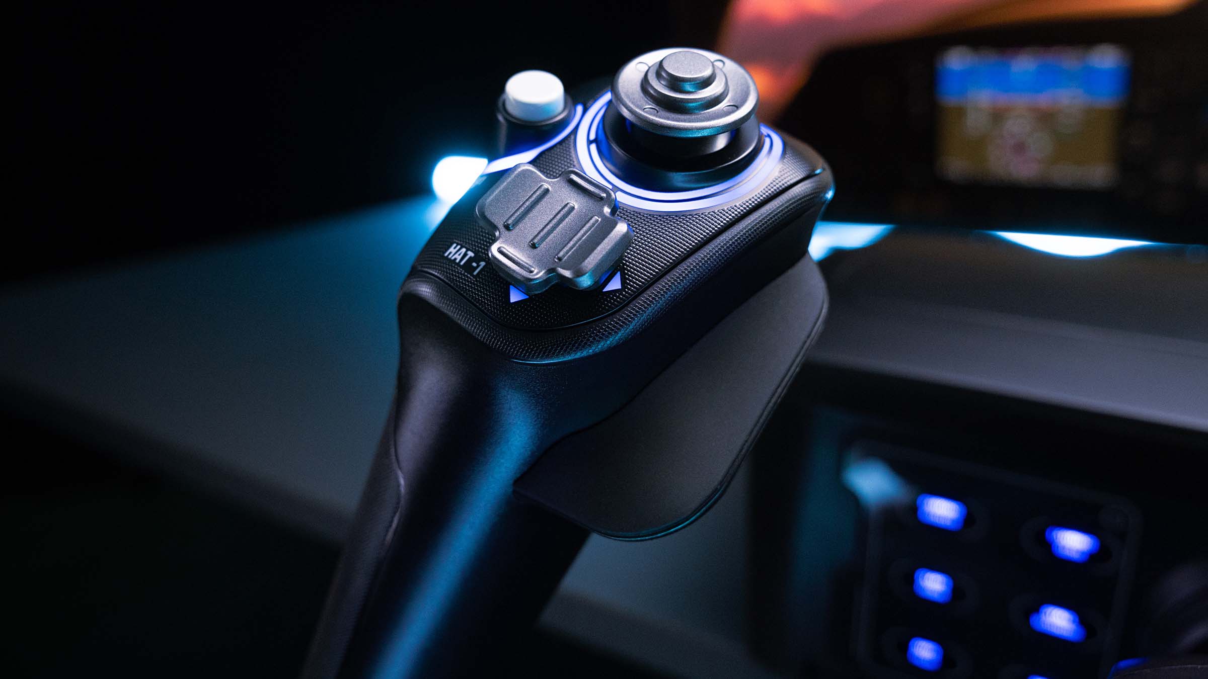 Close official use photo of a hand on the VelocityOne Flight yoke control